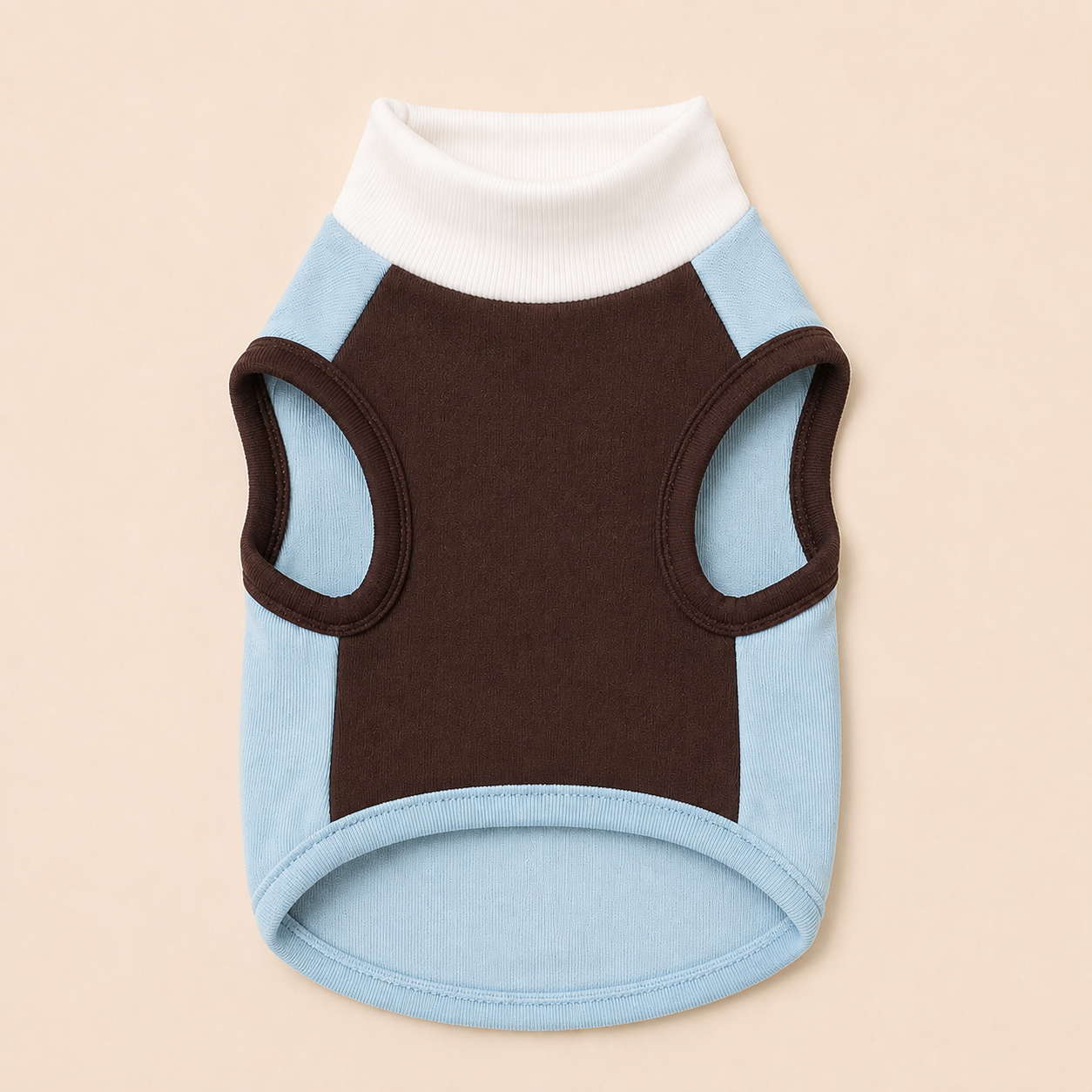 A pet sweater with a white ribbed mock neck, a dark brown center panel, and light blue side panels and armholes, shown on a solid beige background.